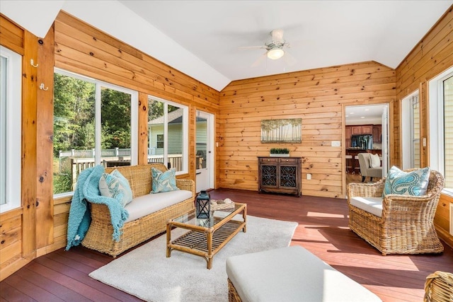 371 Tibbetts Hill Rd, Goffstown, NH 03045 - living area with lofted ceiling, wooden walls, hardwood / wood-style flooring, and a ceiling fan