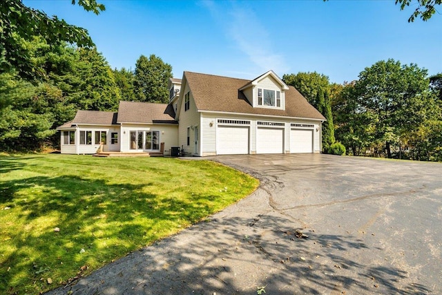 371 Tibbetts Hill Rd, Goffstown, NH 03045 - view of front facade with driveway, a front lawn, and an attached garage