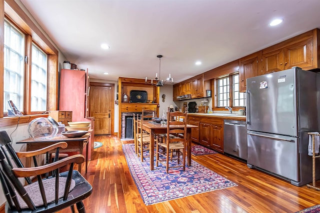 dining room featuring hardwood / wood-style floors and recessed lighting