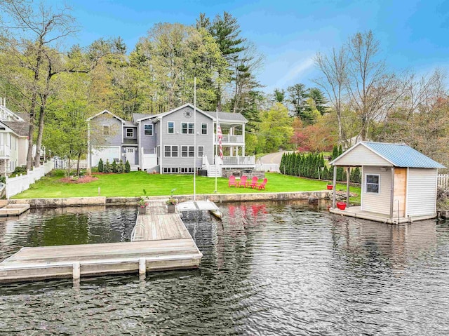 dock area featuring a water view and a yard