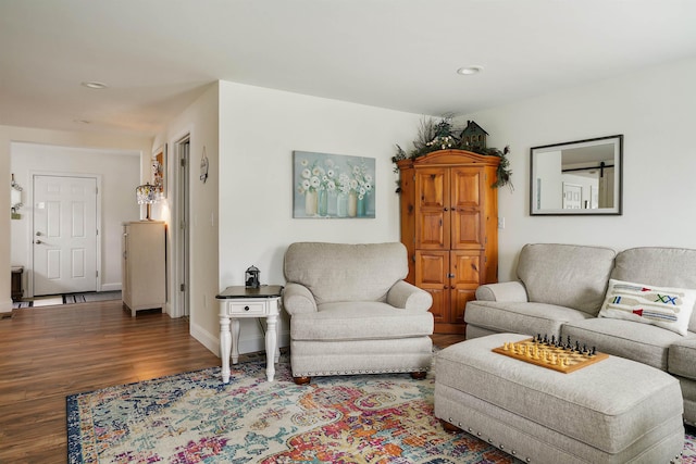 living area featuring wood finished floors, recessed lighting, and baseboards