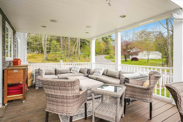 wooden deck featuring an outdoor living space