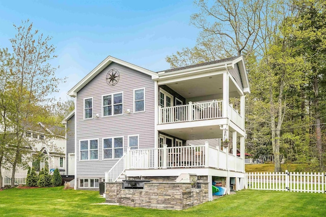 rear view of property featuring a balcony