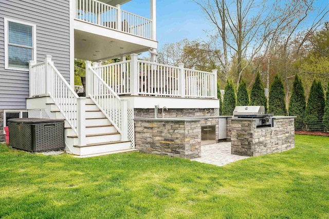 view of patio with area for grilling, grilling area, and stairs