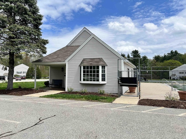 bungalow-style house with a gate and fence