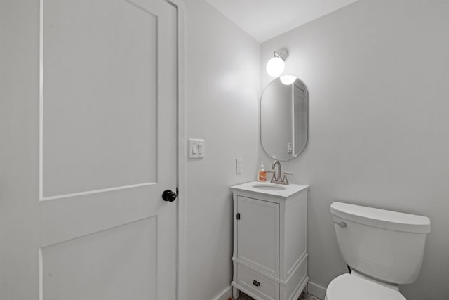 28 Fox Run Rd Unit 1And 2, Lincoln, NH 03251 - bathroom with toilet, vanity, and baseboards