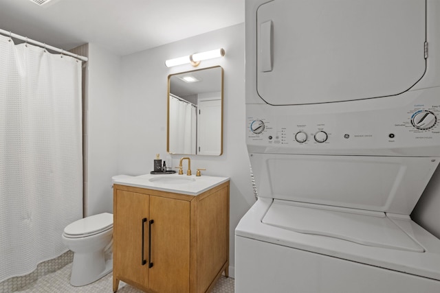 28 Fox Run Rd Unit 1And 2, Lincoln, NH 03251 - full bath with stacked washer and clothes dryer, toilet, tile patterned flooring, and vanity