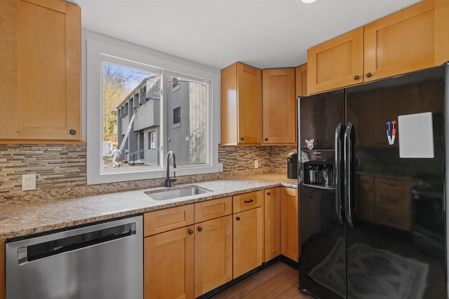 28 Fox Run Rd Unit 1And 2, Lincoln, NH 03251 - kitchen with black fridge with ice dispenser, dishwasher, a sink, wood finished floors, and decorative backsplash