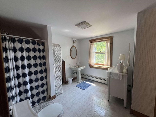 full bathroom with baseboard heating, a shower with shower curtain, and toilet