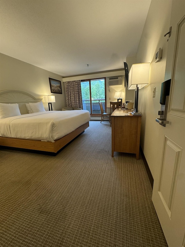 bedroom with carpet flooring, access to outside, a wall mounted air conditioner, and baseboards