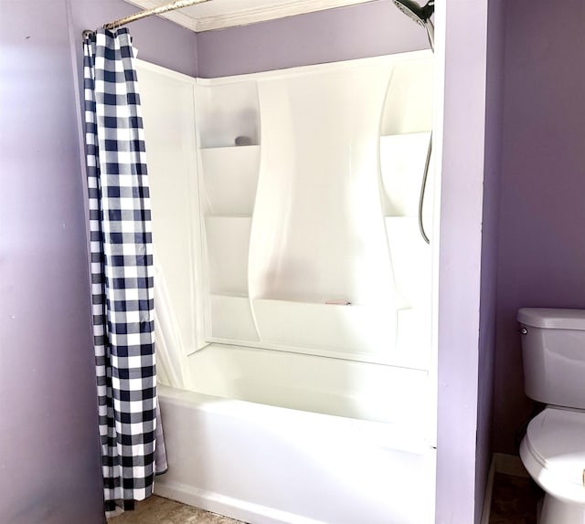 bathroom featuring toilet and shower / bath combo with shower curtain