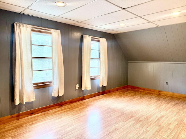 bonus room featuring wood finished floors and baseboards