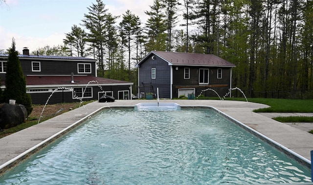 swimming pool featuring fence