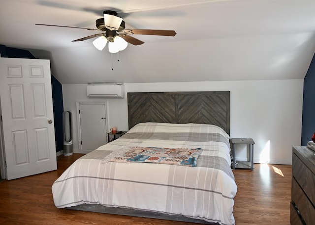 bedroom featuring a wall mounted AC, lofted ceiling, wood finished floors, a ceiling fan, and baseboards