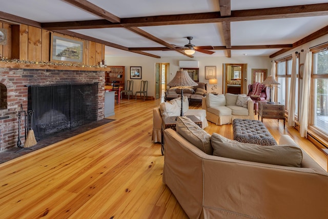 406 Partridge Lake Rd, Littleton, NH 03561 - living room with beamed ceiling, coffered ceiling, light wood-style floors, a fireplace, and ceiling fan