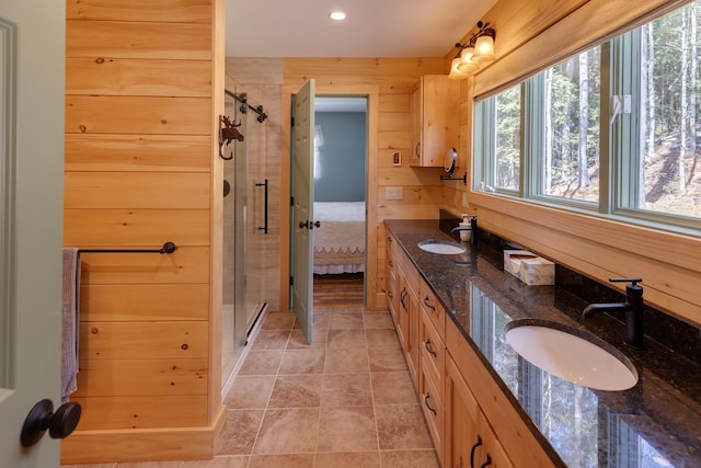 406 Partridge Lake Rd, Littleton, NH 03561 - bathroom featuring a stall shower, double vanity, connected bathroom, and recessed lighting