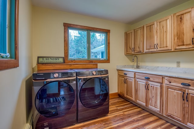 406 Partridge Lake Rd, Littleton, NH 03561 - washroom with washing machine and clothes dryer, cabinet space, and light wood finished floors