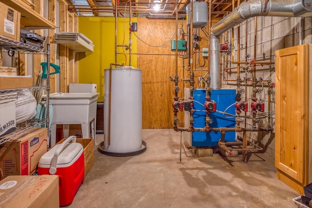 406 Partridge Lake Rd, Littleton, NH 03561 - utilities with gas water heater, a heating unit, and a sink