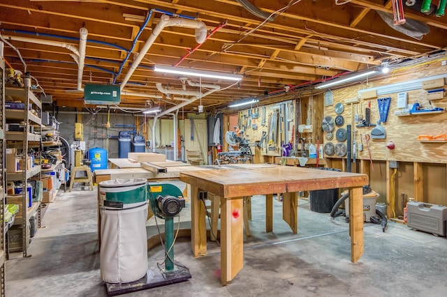 406 Partridge Lake Rd, Littleton, NH 03561 - unfinished basement with a workshop area and a water pressure tank