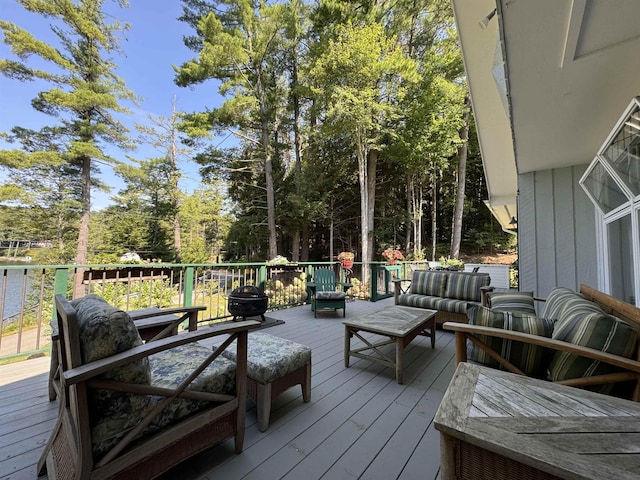 406 Partridge Lake Rd, Littleton, NH 03561 - wooden deck featuring outdoor lounge area and view of wooded area