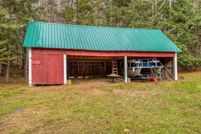 406 Partridge Lake Rd, Littleton, NH 03561 - view of pole building featuring a lawn and a carport