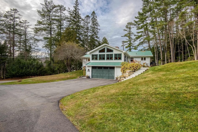 406 Partridge Lake Rd, Littleton, NH 03561 - view of home's exterior featuring asphalt driveway, metal roof, a garage, stairs, and a yard