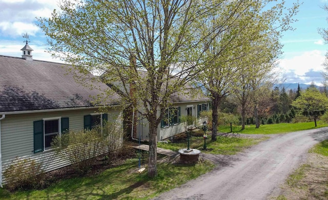 1202 Cotton Rd, Lyndon, VT 05851 - view of side of property featuring a shingled roof