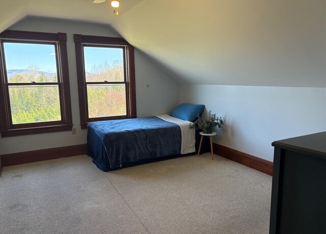 1202 Cotton Rd, Lyndon, VT 05851 - carpeted bedroom with vaulted ceiling and baseboards