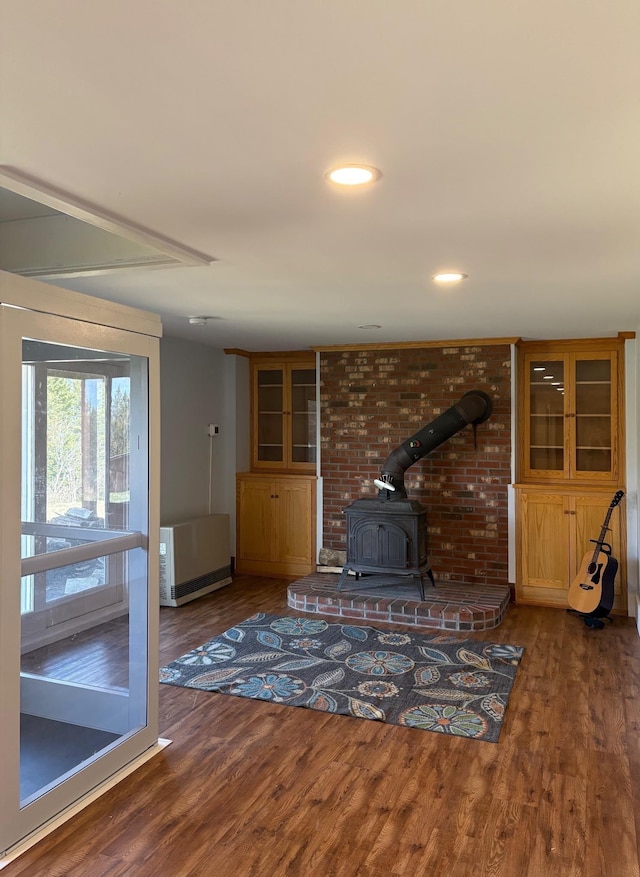 1202 Cotton Rd, Lyndon, VT 05851 - unfurnished living room with a wood stove, wood finished floors, and recessed lighting