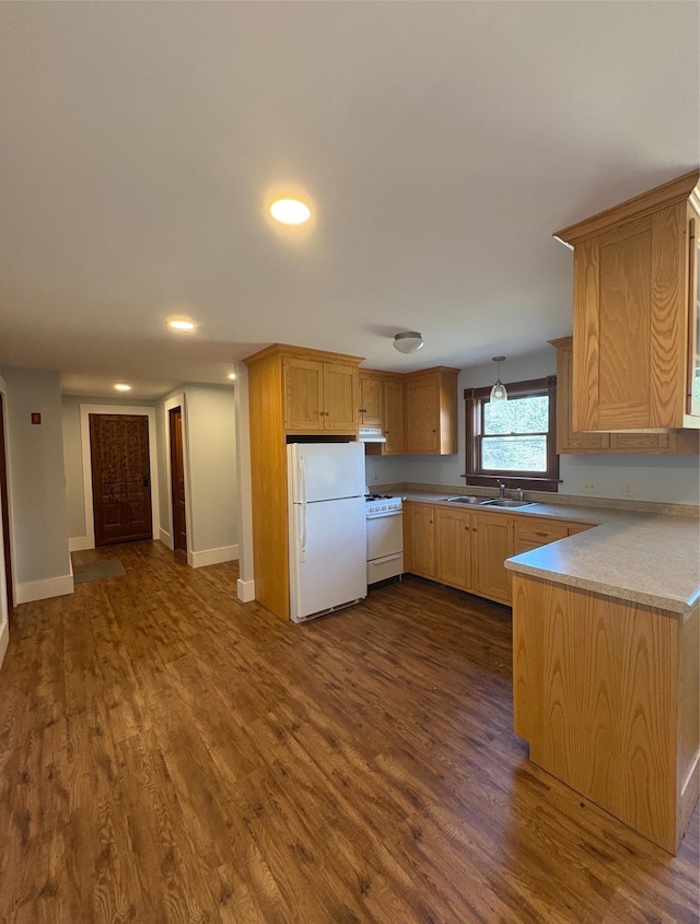 1202 Cotton Rd, Lyndon, VT 05851 - kitchen with white appliances, a sink, dark wood finished floors, exhaust hood, and a peninsula