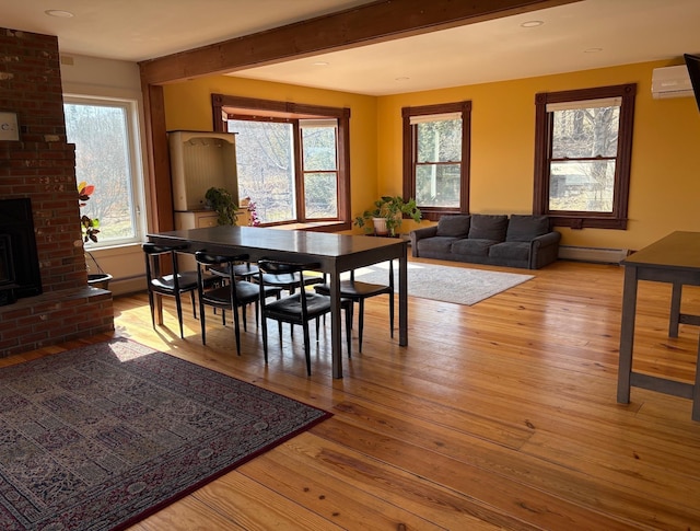 1202 Cotton Rd, Lyndon, VT 05851 - dining space featuring plenty of natural light, light wood finished floors, baseboard heating, beam ceiling, and recessed lighting