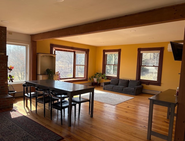 1202 Cotton Rd, Lyndon, VT 05851 - dining area featuring a baseboard radiator, plenty of natural light, hardwood / wood-style flooring, beamed ceiling, and recessed lighting