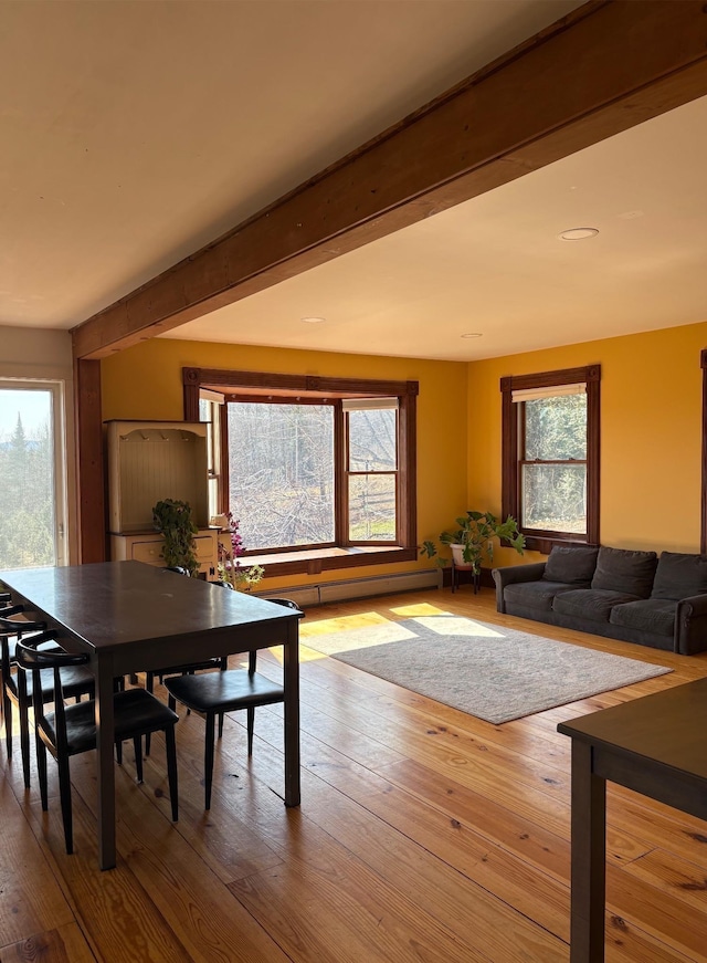 1202 Cotton Rd, Lyndon, VT 05851 - dining area featuring hardwood / wood-style flooring and beam ceiling