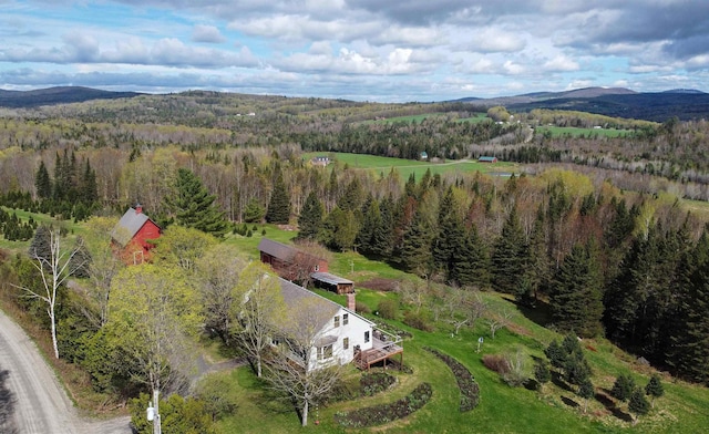 1202 Cotton Rd, Lyndon, VT 05851 - view from above of property with a heavily wooded area and mountains