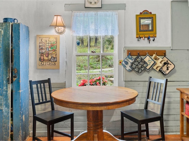 dining area featuring a textured wall
