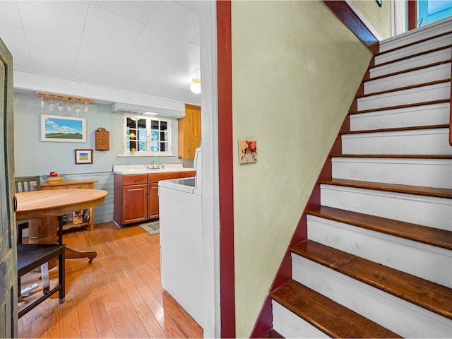 stairway featuring wood-type flooring