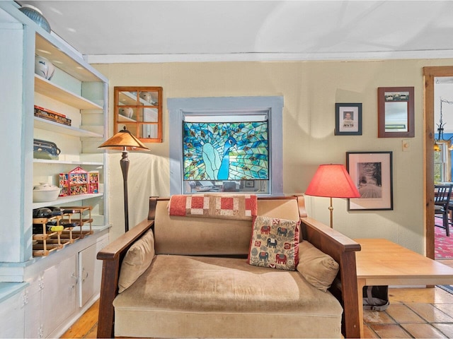 sitting room featuring crown molding