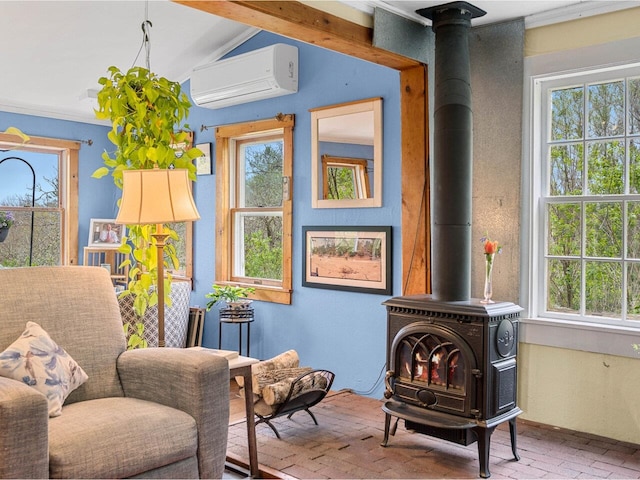 sitting room featuring brick floors, a wood stove, and an AC wall unit