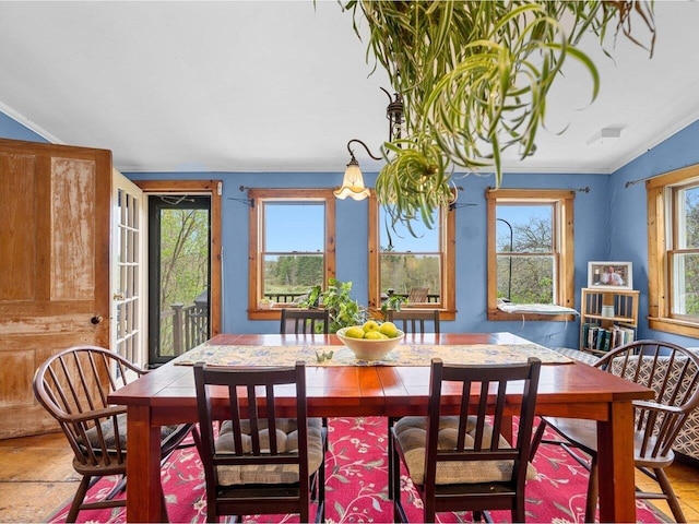 dining area with crown molding