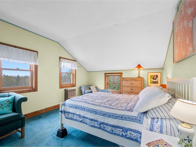 bedroom with vaulted ceiling, carpet floors, baseboards, and multiple windows
