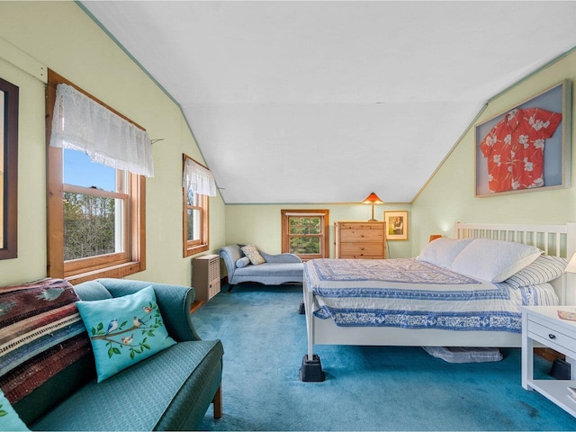bedroom with carpet flooring and lofted ceiling