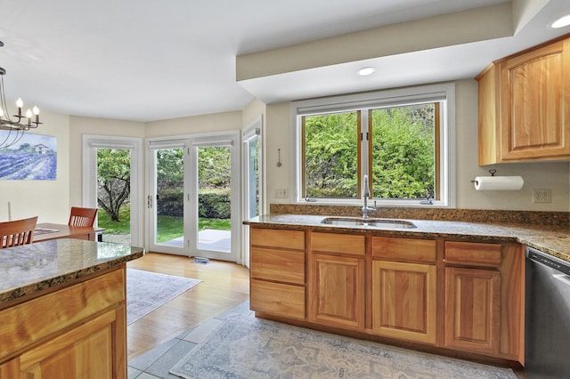 17 Ches Mae Ln, Milford, NH 03055 - kitchen with a sink, dishwasher, dark stone countertops, a chandelier, and pendant lighting