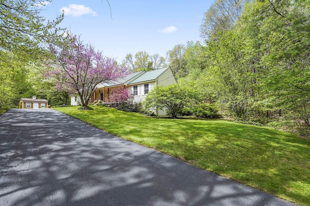 17 Ches Mae Ln, Milford, NH 03055 - view of side of home with driveway, a yard, and metal roof