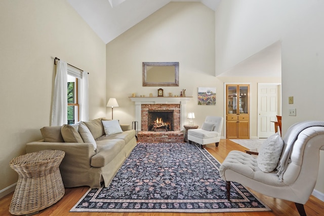 17 Ches Mae Ln, Milford, NH 03055 - living area featuring high vaulted ceiling, wood finished floors, a fireplace, and baseboards