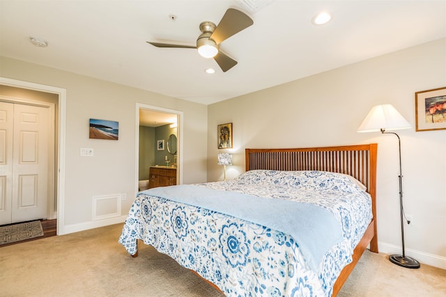 bedroom featuring carpet floors, recessed lighting, a ceiling fan, baseboards, and ensuite bathroom