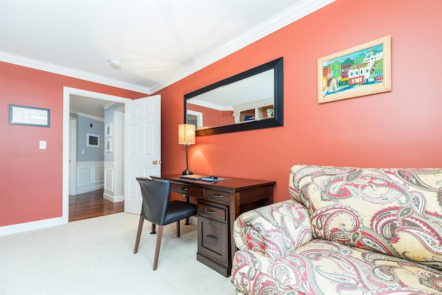 office space featuring ornamental molding, a wainscoted wall, and light colored carpet
