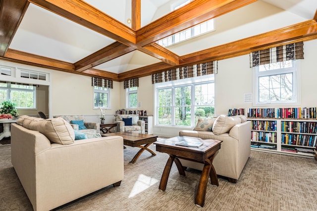 living room with healthy amount of natural light, beamed ceiling, coffered ceiling, and light colored carpet