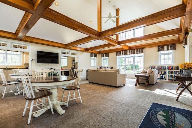 living room with carpet flooring, beam ceiling, and a ceiling fan