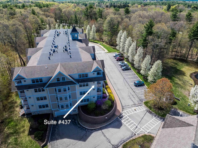 view from above of property with a forest