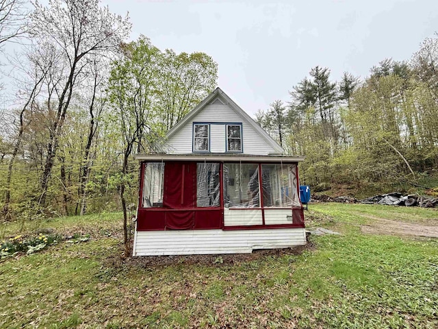 23 Mason Hill Rd, Tamworth, NH 03886 - view of property exterior featuring a sunroom and a lawn